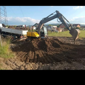 VOLVO BAGER SA MONTABERT PIKAMEROM,ZAMJENA